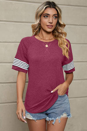 Burgundy raglan sleeve tee with white striped cuffs and X-stitch neckline detail.