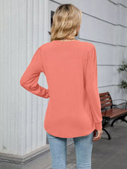 Coral V-neck long sleeve maternity t-shirt with gathered shoulder detail.