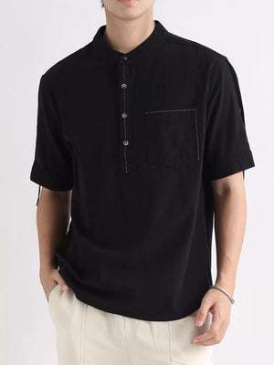Black cotton button-down shirt with mandarin collar and chest pocket.
