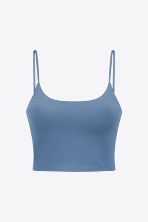 Light blue scoop neck crop tank top with thin spaghetti straps.