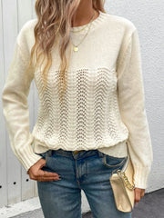 Cream crewneck knit sweater with lace inset detail and long sleeves.