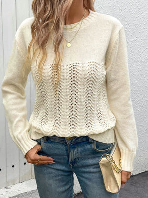 Cream crewneck knit sweater with lace inset detail and long sleeves.