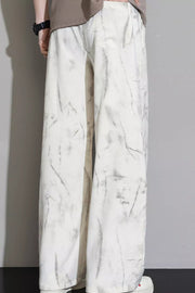 Men's white sweatpants with marbled grey pattern and drawstring waist.