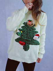 White knit sweater with 3D Christmas tree embellishment, Santa, reindeer, star, and heart details.