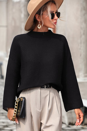 Black ribbed mock neck sweater with volume sleeves