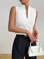 White textured sleeveless blouse with notched V-neck