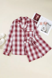 Red plaid cotton pajama set with pocketed button-up top and drawstring shorts.