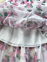 Charming floral midi dress with ruffle hem, white with pink roses, cotton blend fabric.