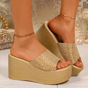 Gold leopard print platform wedge sandals with open toe and ankle chains.