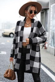Black and white checkerboard knit duster coat with open front and long sleeves.