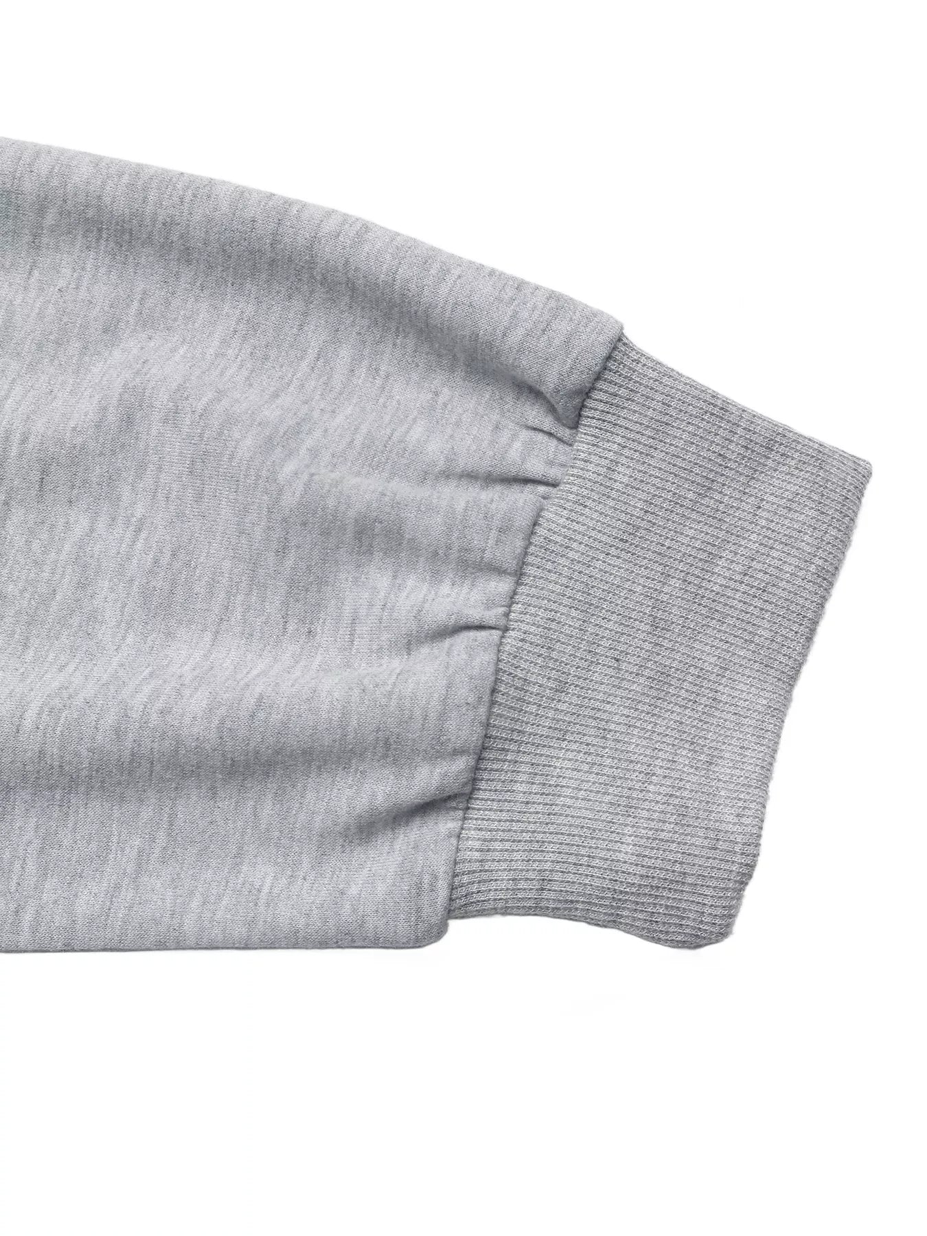 Gray sweater sleeve with ribbed cuff and gathered detail
