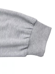 Gray sweater sleeve with ribbed cuff and gathered detail