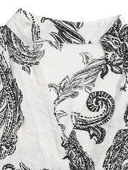 Paisley print maternity maxi dress with notched neckline and ruffles in black and white.