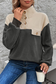 Colorblock fleece pullover with button-up neckline and chest pocket in dark gray and beige.