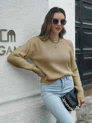 Khaki cold shoulder knit sweater with a textured stitch pattern.