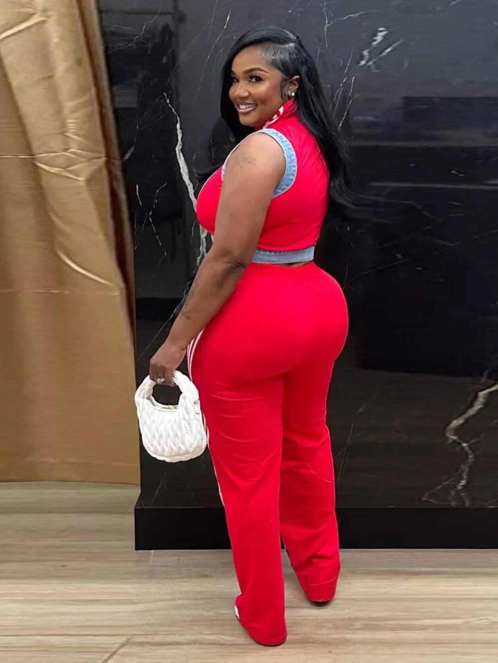 Red zip-front crop top and wide-leg pants set with denim trim and white stripe detail.