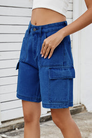 Medium wash denim utility shorts with cargo pockets and contrast stitching.