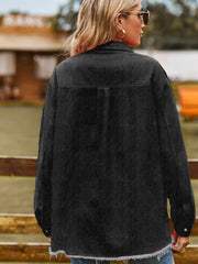 Black frayed edge overshirt with patch pockets and button cuffs.