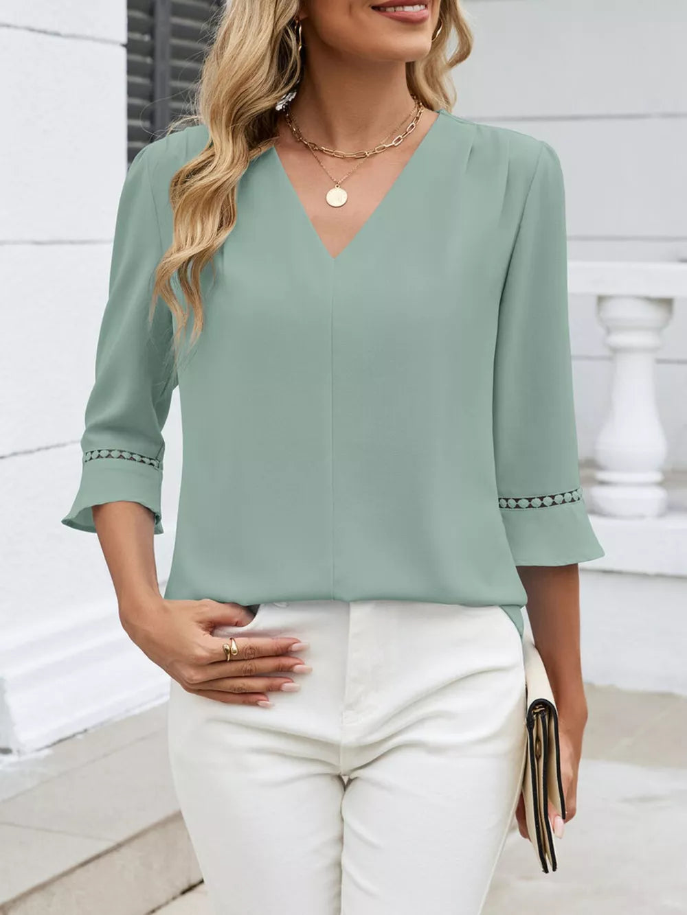 Bean green V-neck blouse with 3/4 sleeves featuring lace trim detail