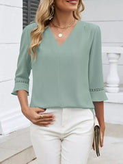 Bean green V-neck blouse with 3/4 sleeves featuring lace trim detail