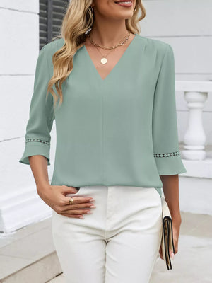 Bean green V-neck blouse with 3/4 sleeves featuring lace trim detail