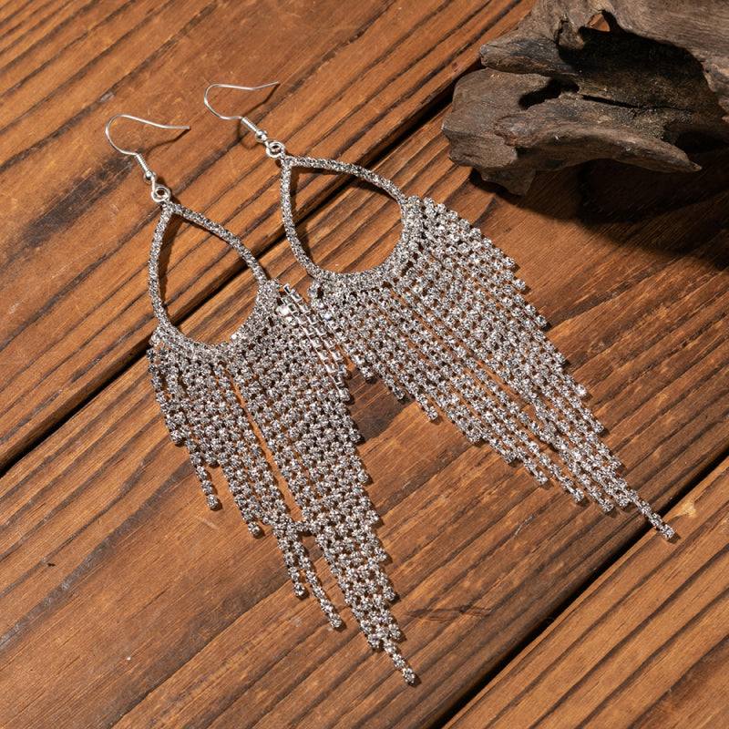 Crystal raindrop chandelier earrings with cascading rhinestones on alloy hooks.