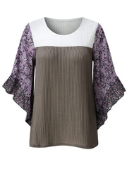 Textured panel blouse with white and gray waffle knit body and purple floral flutter sleeves.