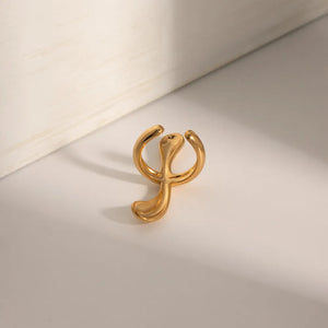 Gold ear cuff with fluid, sculptural design, 18K gold-plated