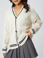 White cable knit cardigan with black stripe trim and buttons