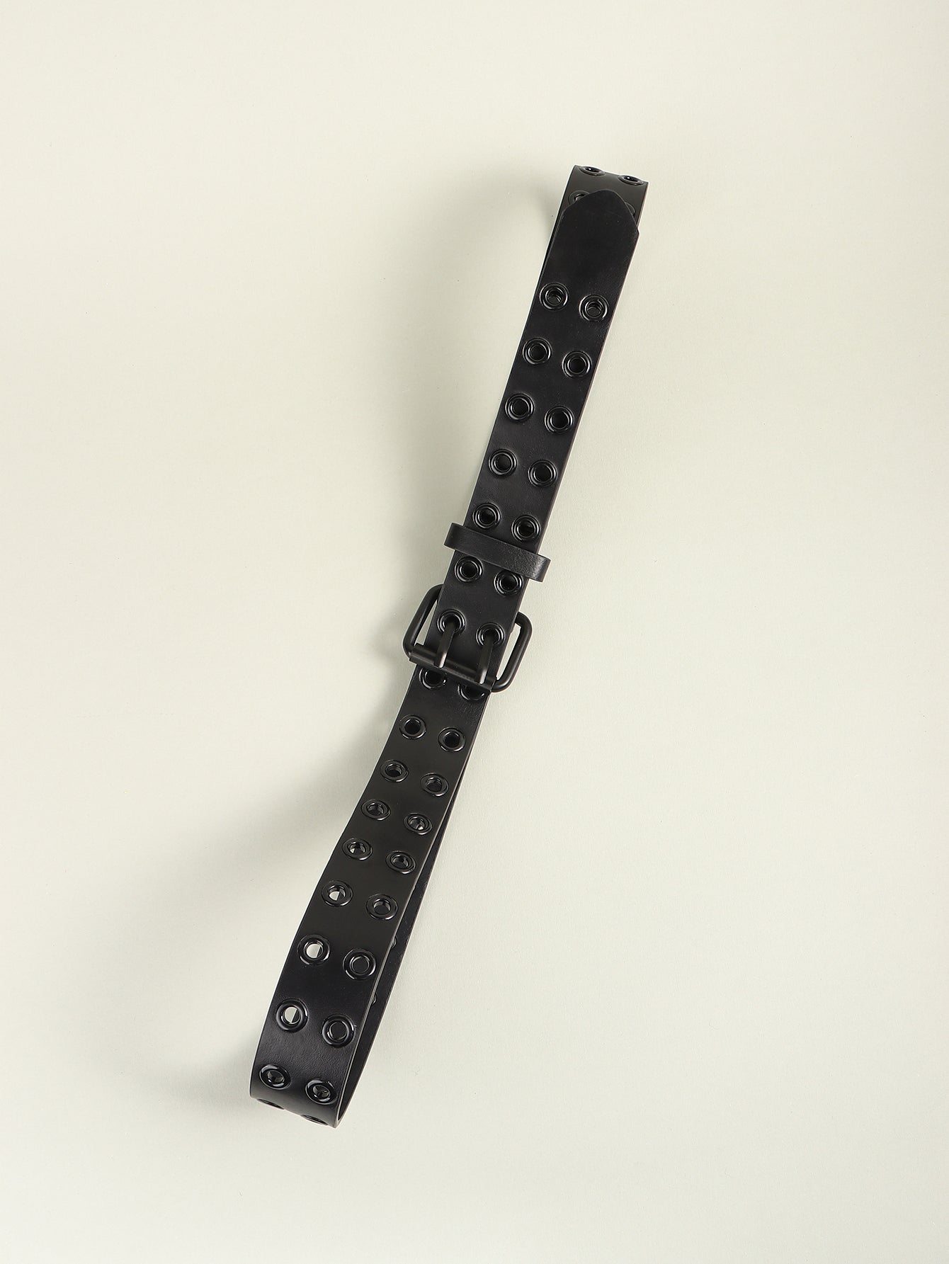 Black vegan leather belt with double row of grommets and silver buckle