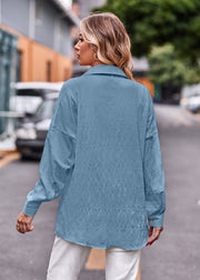 Sky blue textured overshirt with relaxed fit and buttoned cuffs.