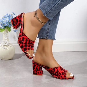 Leopard print block heel mules in Deep Red with open toe and chunky heel.