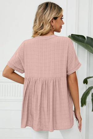 Dusty pink linen blouse with gathered back detail and short sleeves.