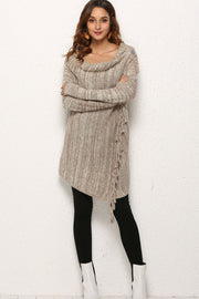Asymmetric fringe knit cardigan in oatmeal with cowl neck and button detail.