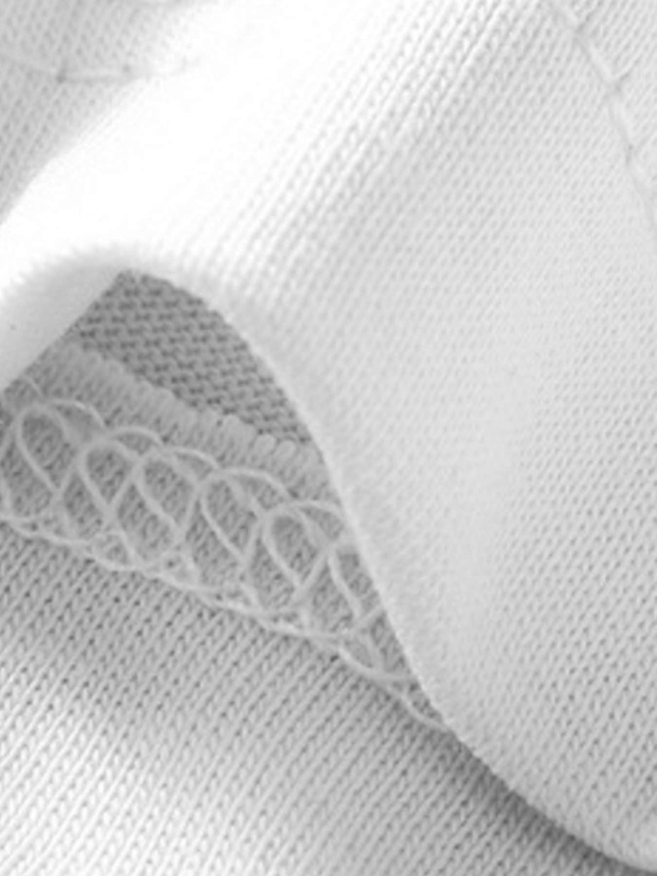 White cotton toddler t-shirt showing fabric texture and stitching detail.