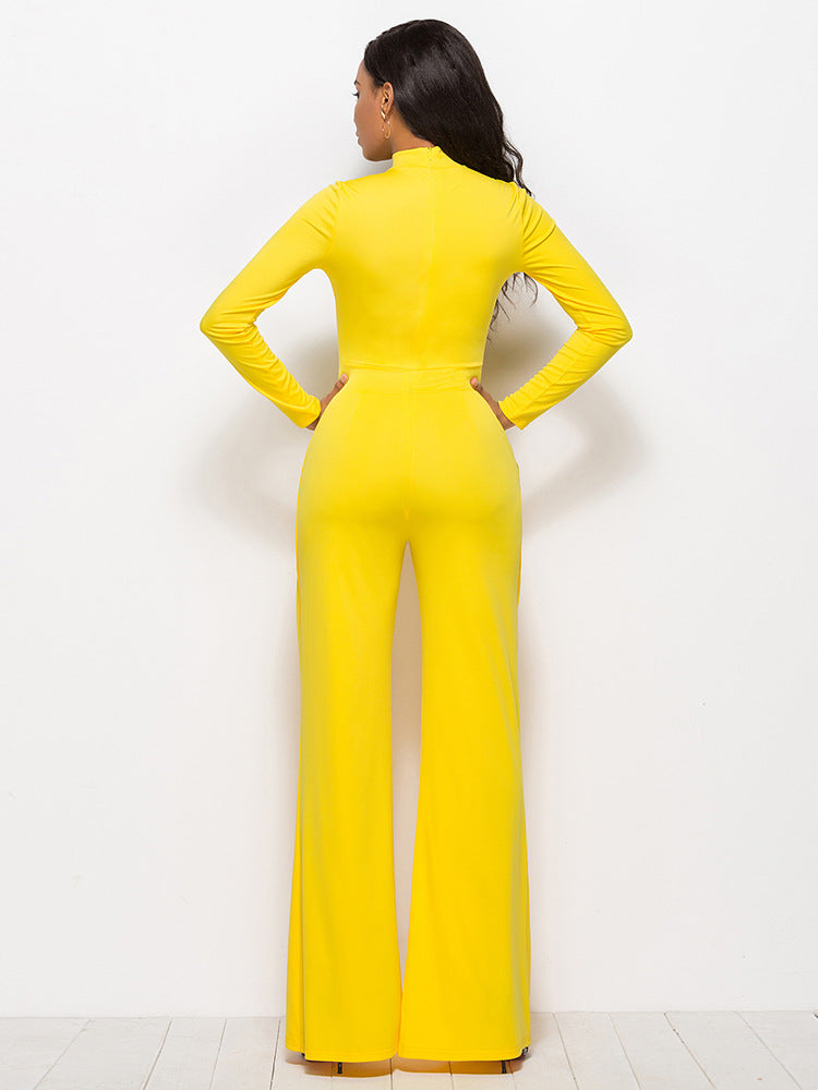 Yellow high-waisted palazzo jumpsuit with long sleeves and a mock neck.