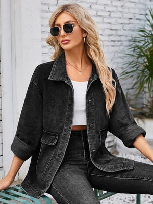 Black denim button-up jacket with cuffed sleeves and chest pockets.