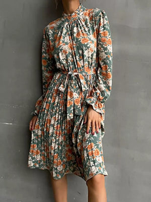 Green floral midi dress with tie waist and pleated skirt