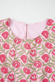 Floral print crop top in dusty pink with pink blooms and green leaves, round neck, back zipper detail.