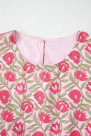 Floral print crop top in dusty pink with pink blooms and green leaves, round neck, back zipper detail.