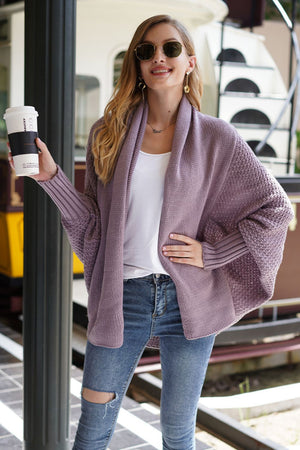 Lavender cocoon knit sleeve cardigan with open front and textured sleeves.