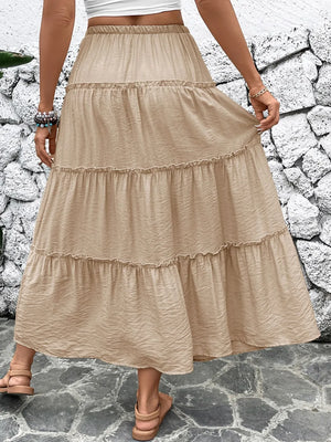 Tiered maxi skirt in tan with drawstring waist and ruffled tiers.