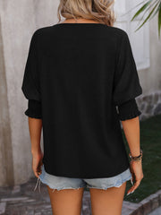 Black blouse with shirred sleeves and keyhole neckline detail
