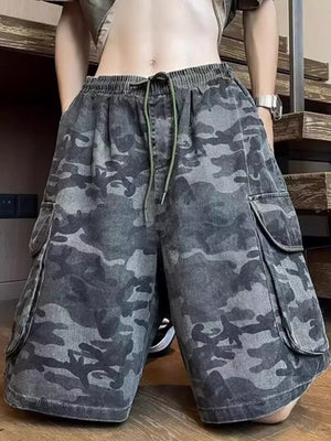 Relaxed fit black camo cargo shorts with drawstring waist and multiple pockets.