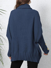 Dark Blue turtleneck sweater with button cuff detail and ribbed hem.