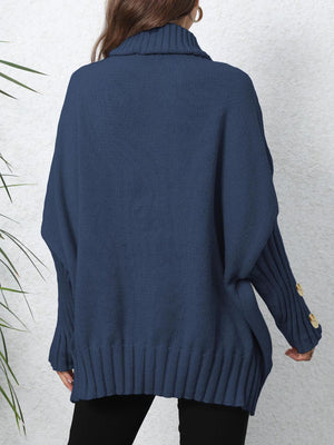 Dark Blue turtleneck sweater with button cuff detail and ribbed hem.
