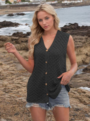 Black openwork knit vest with V-neck and button front, styled with denim shorts.