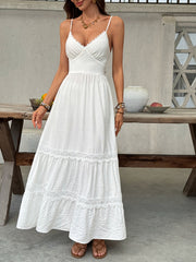White lace tiered maxi dress with spaghetti straps and scalloped neckline.