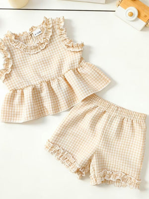 Children's beige gingham ruffle two-piece set with peplum top and shorts.