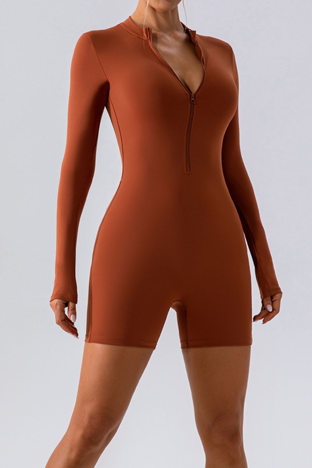 Caramel long sleeve romper with zip detail and short legs